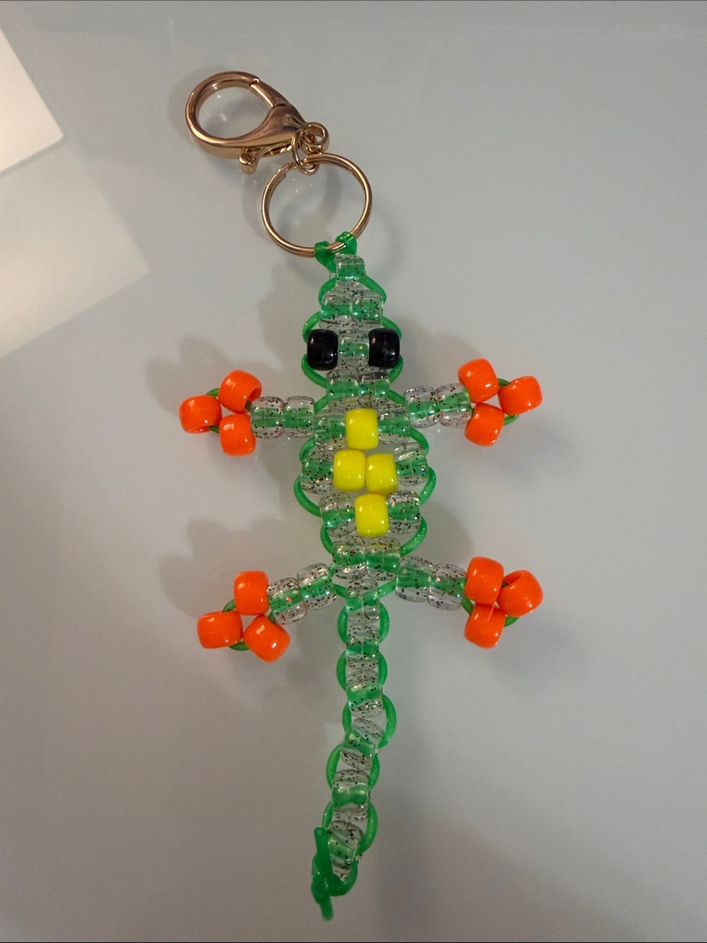 Green, yellow, orange sparkle lizard pony bead key chain!